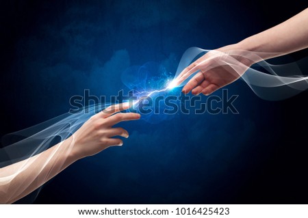 Two male arms reaching for each other, with a smoking electric current connecting their fingers in empty space background concept