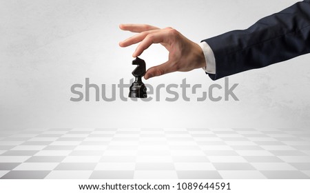 Big elegant hand taking his next step on chess game