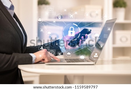Business woman below chest working on laptop in a cozy homey environment with secured connection concept