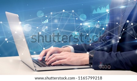 Hand typing on laptop with online accounting system concept