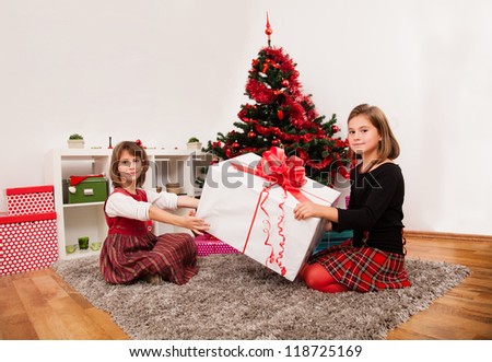 Happy kids under the christmas tree