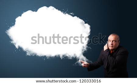 Businessman in suit making phone call and presenting abstract cloud copy space