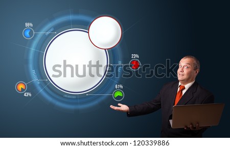 businessman in suit holding a laptop and presenting abstract modern pie chart with copy space