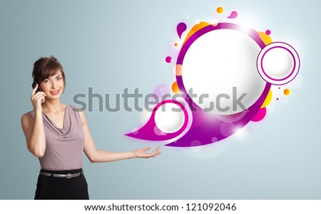 Pretty young woman presenting abstract speech bubble copy space and making phone call