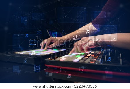 Hand remixing music on midi controller with play music and multimedia  concept