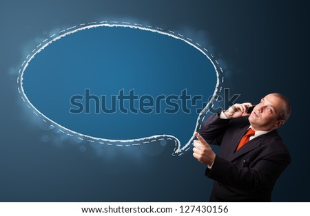 funny businessman in suit holding a phone and presenting speech bubble copy space