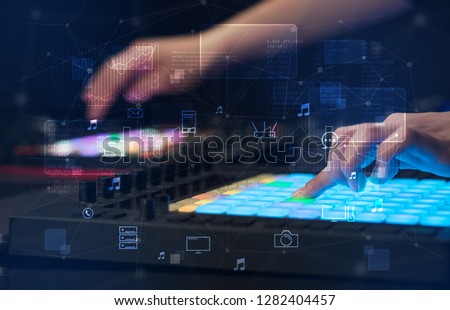 Hand remixing music on midi controller with play music and multimedia  concept