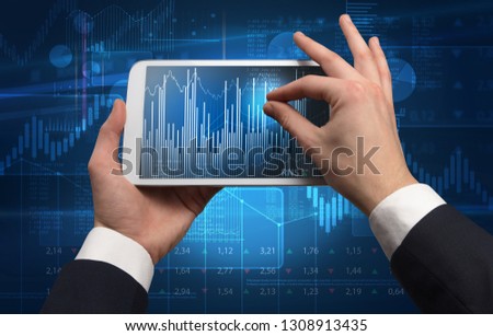 First person hand using tablet and checking financial report on cloud computing system