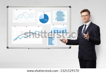 Handsome businessman presenting report on white board with laser pointer