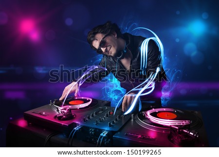 Young Disc Jockey Playing Music With Electro Light Effects And Lights