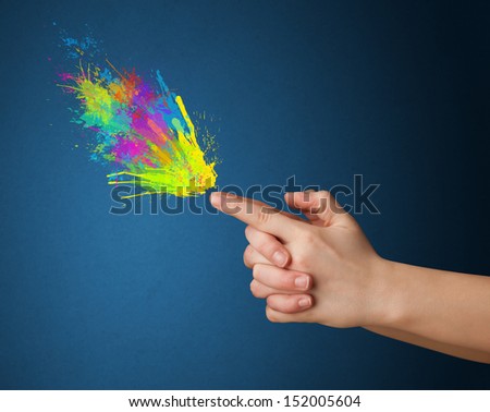 Colored splashes are coming out of gun shaped hands