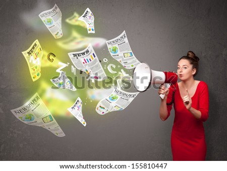 Cute girl yelling into loudspeaker and newspapers fly out