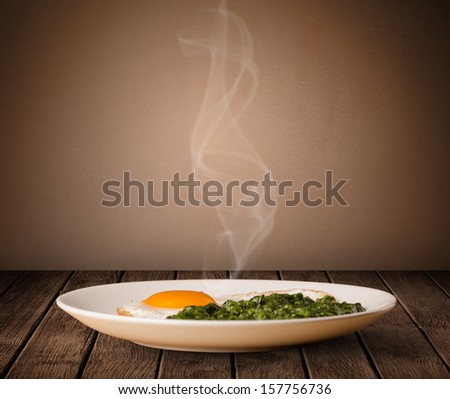 Fresh delicious home cooked food with steam on wood deck