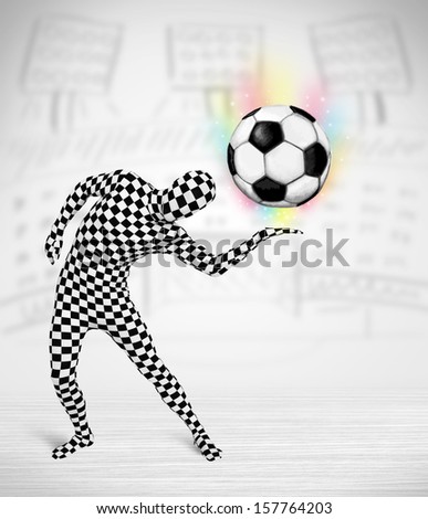 Funny man in full body suit holdig soccer ball