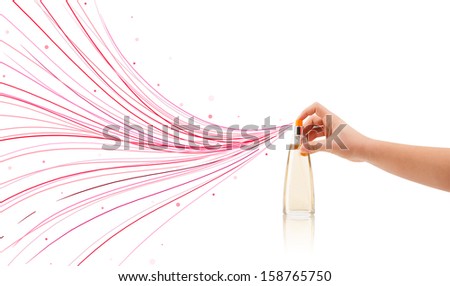 close up of woman hands spraying colorful lines from beautiful perfume bottle