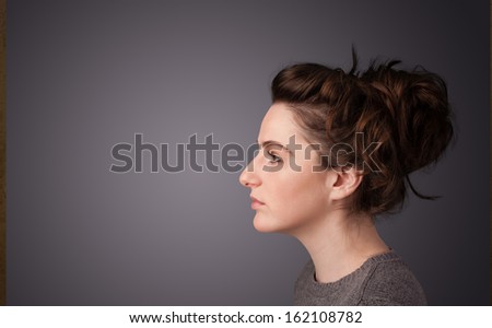Young girl portrait thinking with plain copyspace