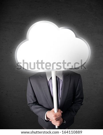 Businessman standing and hiding his head behind an empty cloud