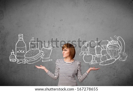 Pretty young woman choosing between healthy and unhealthy foods