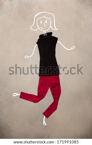 Colorful placed clothes in different actions with woman drawing
