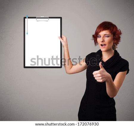 Beautiful young girl holding black folder with white sheet copy space