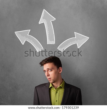 Young businessman deciding with sketched arrows above his head