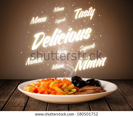 Food plate with delicious and tasty glowing writings on wood deck