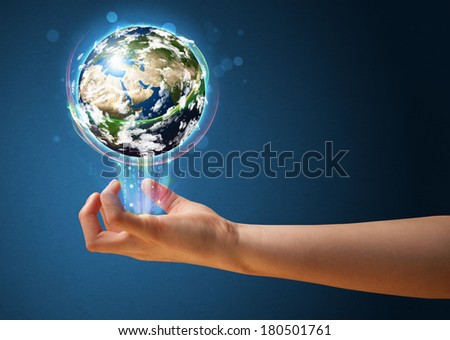 Young woman holding in her hand a glowing earth globe, Elements of this image furnished by NASA