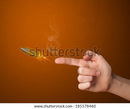 Gun shaped male hand with bullet coming out of it