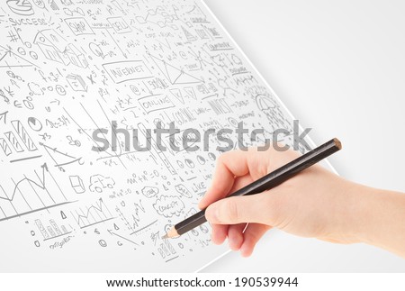 Human hand sketching multiple ideas on a paper