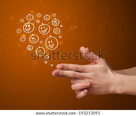 Group of happy hand drawed smiley faces coming out of gun shaped hands