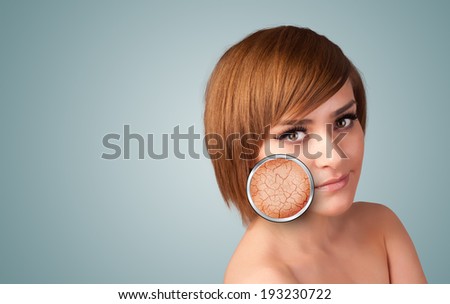 Healthy beautiful young girl with magnifying glass of skin damage