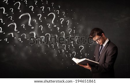 Confused man reading a book with question marks coming out from it