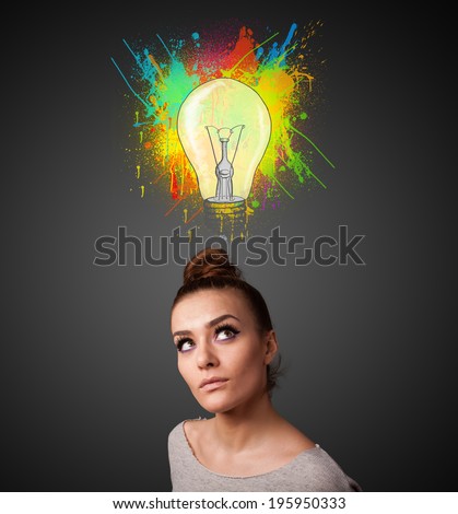Pretty young woman gesturing with lightbulb and paint splashes above her head