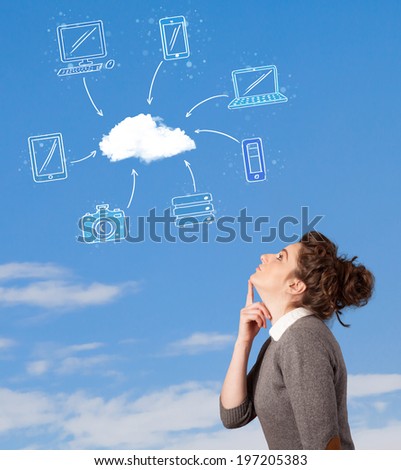 Casual young girl looking at cloud computing concept on blue sky