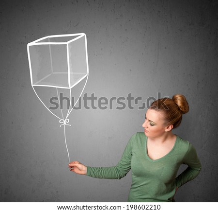 Pretty young woman holding a drawn cube balloon