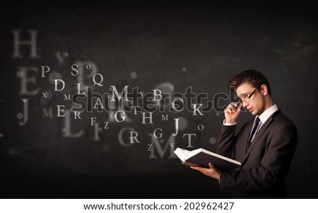 Young man reading a book with alphabet letters coming out of the book