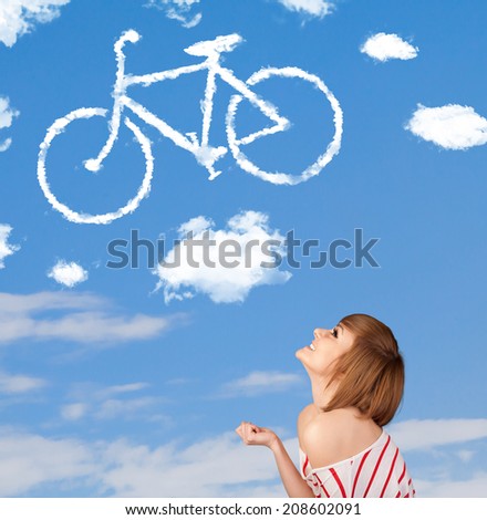 Young casual girl looking at bicycle clouds on blue sky