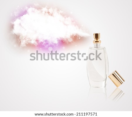 women\'s perfume in beautiful bottle spraying colorful cloud, copyspace in cloud