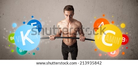 Strong muscular man lifting colorful vitamin weights