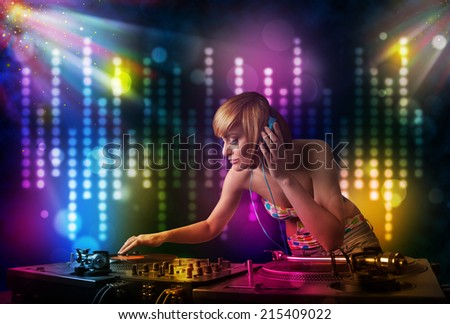 Pretty Dj girl playing songs in a disco with light show