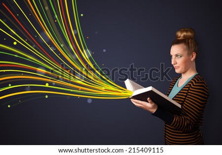 Young woman reading a book while colorful lines are coming out of the book