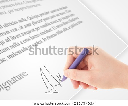 Hand writing personal signature on a legal paper