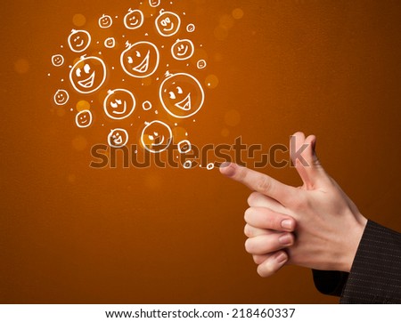 Group of happy hand drawed smiley faces coming out of gun shaped hands