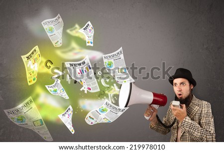 Handsome guy yelling into loudspeaker and newspapers fly out