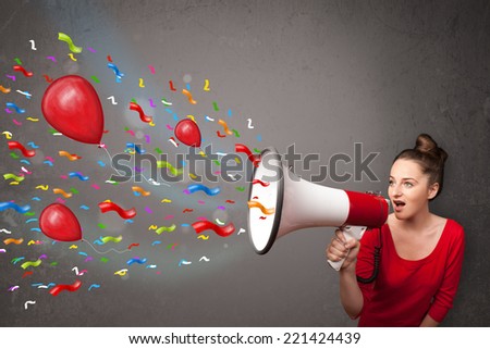 Young girl having fun, shouting into megaphone with balloons and confetti