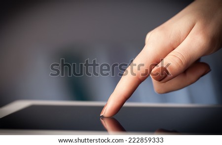 Hand touching tablet pc with copy space