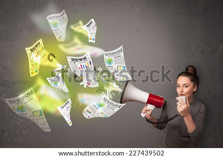 Cute girl yelling into loudspeaker and newspapers fly out