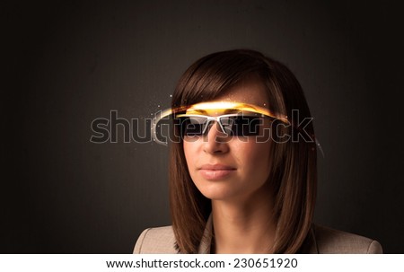 Pretty woman looking with futuristic high tech glasses concept