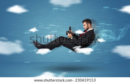 Funny race driver young man driving between clouds concept on blue background