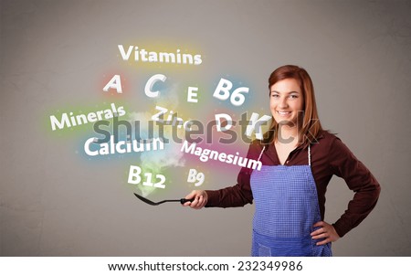 Pretty young woman cooking vitamins and minerals